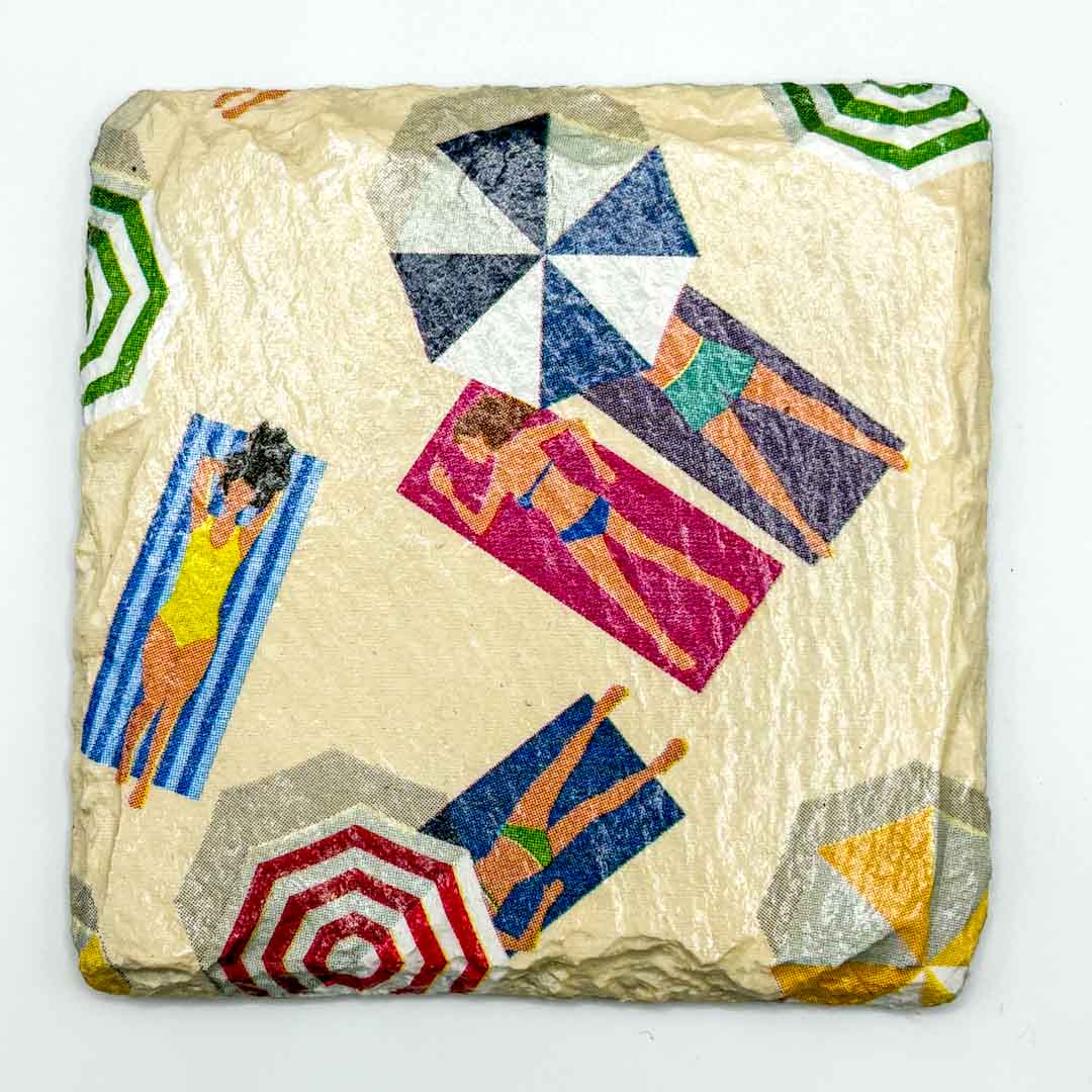 Decorative stone with colorful beach scene design on a white background_Sarah Tustin_Just Makers