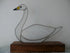 Stained glass swan on a wooden base against a plain background_Just Makers