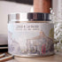 Lemon & Lavender candle in a tin with a scenic label on a wooden surface_Just Makers