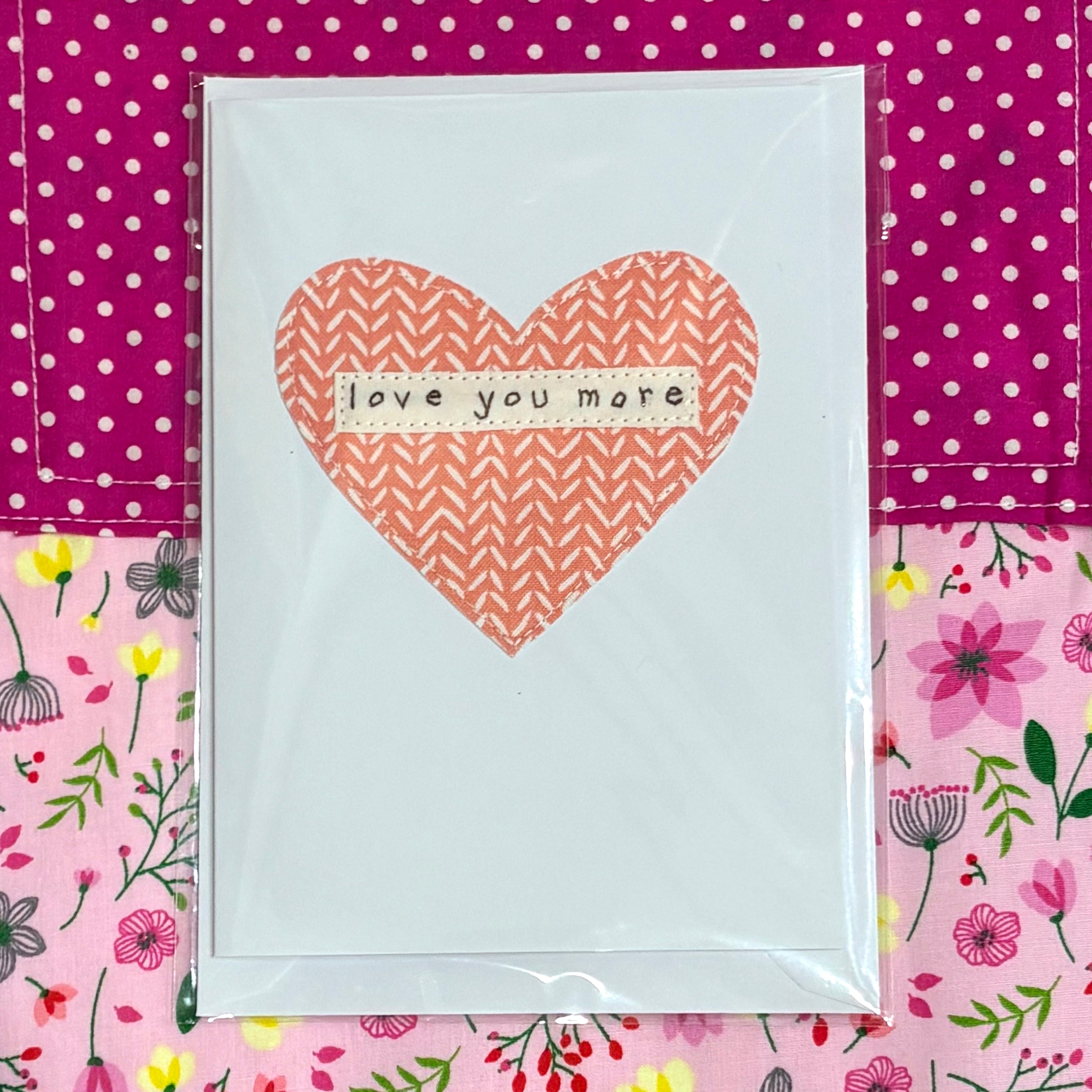 Card with a pink heart and &