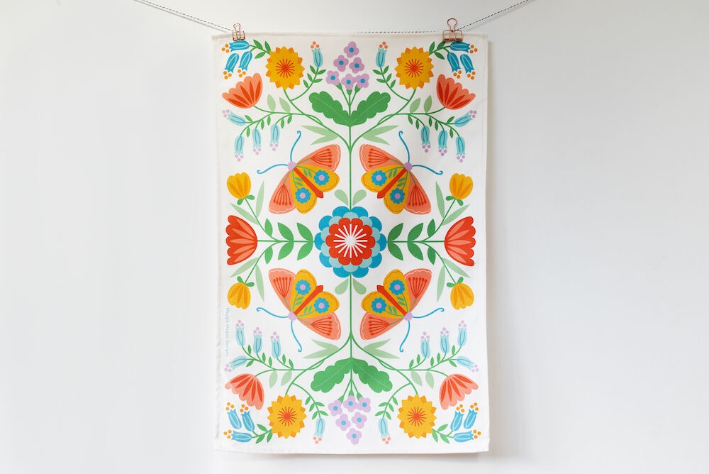 Colorful floral and butterfly pattern on a white background