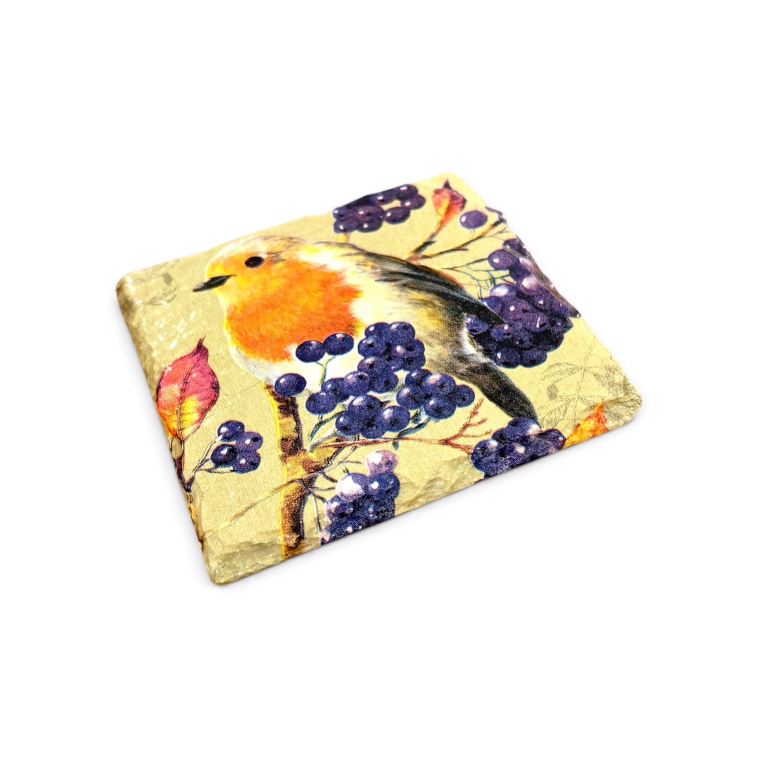 A square decorative coaster featuring a watercolor-style robin bird perched among purple berries on a textured gold background, shown on a plain white studio background.