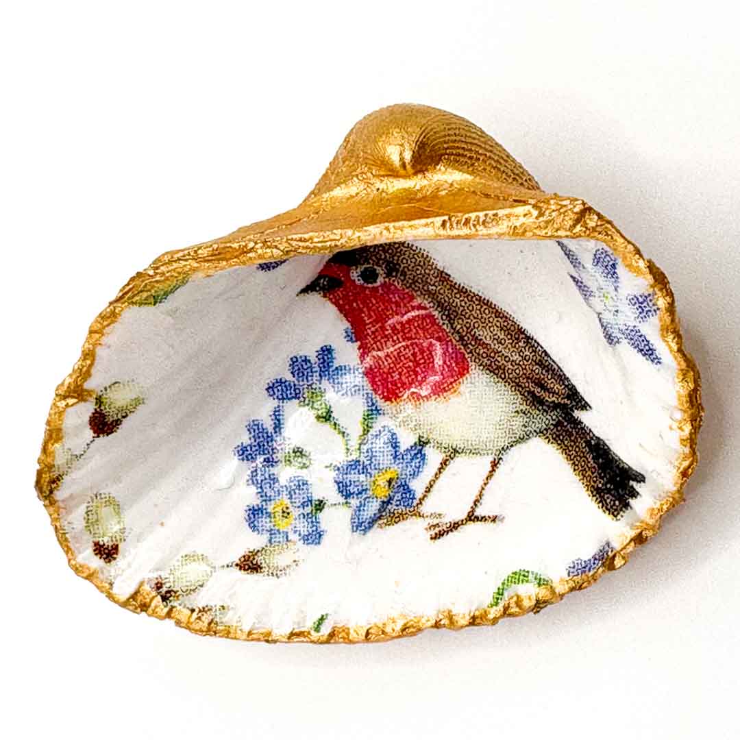 Decorative shell with a painted robin and flowers on a white background_Just Makers