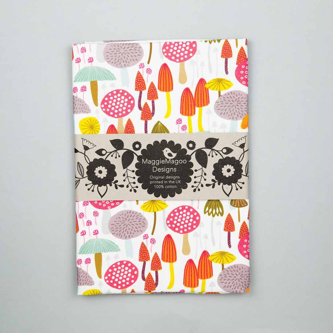Pack of paper with colorful mushroom and flower pattern on a gray background_Maggie Magoo Designs_Just Makers