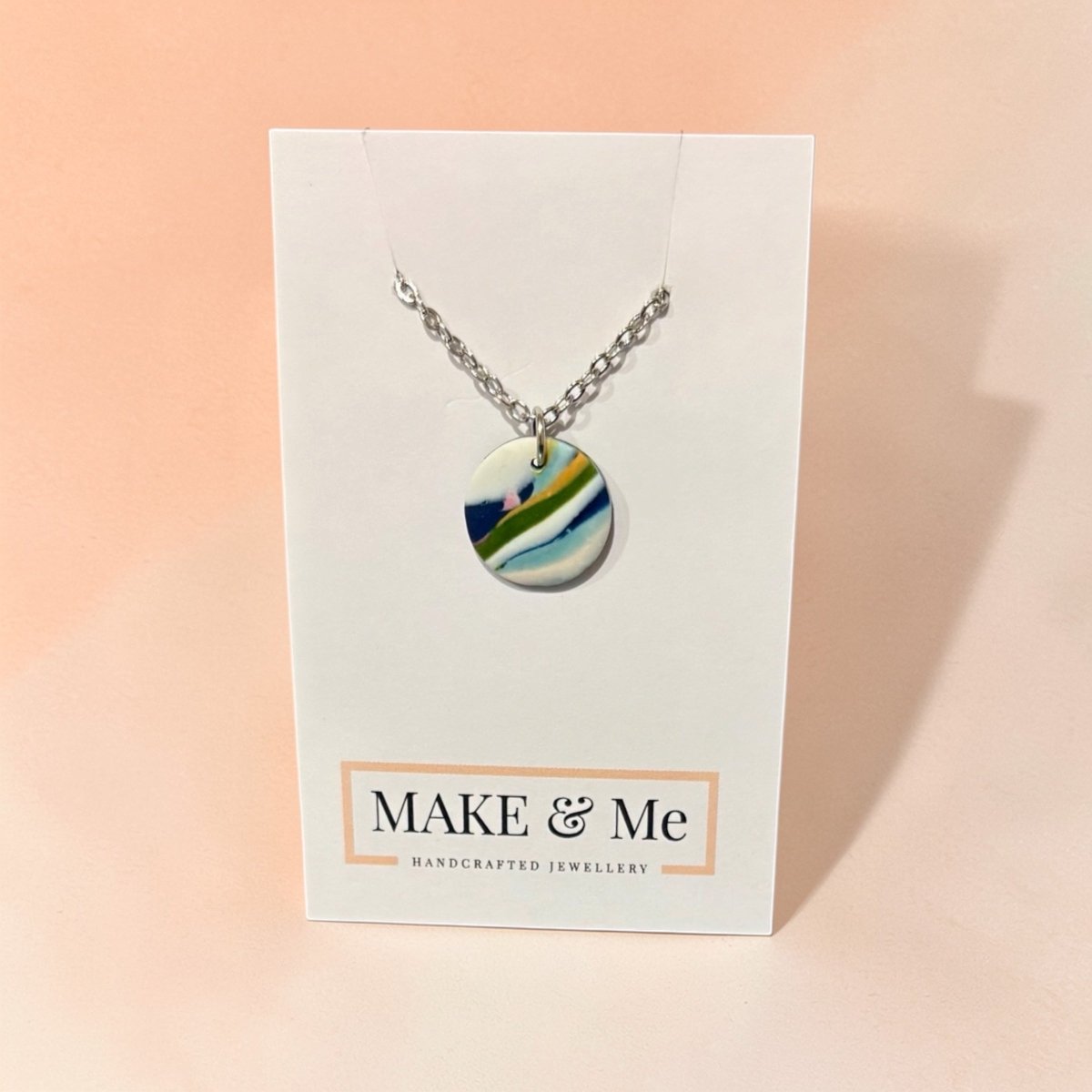 Necklace with a colorful pendant on a &