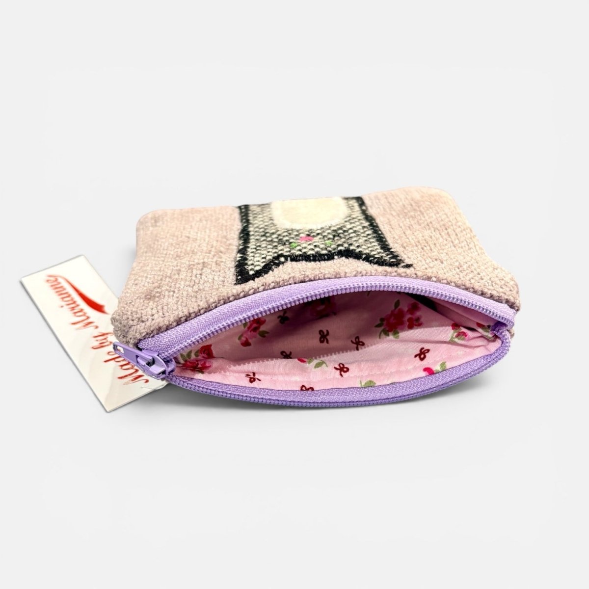 Small pouch with a purple zipper on a white background
