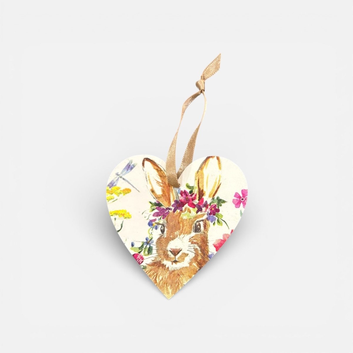 Heart-shaped ornament with a rabbit design and floral elements on a white background