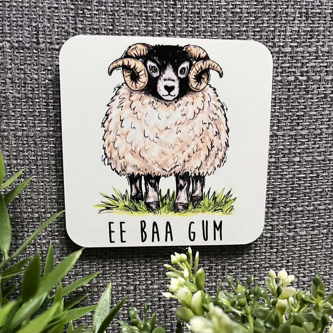Coaster with a sheep illustration and &