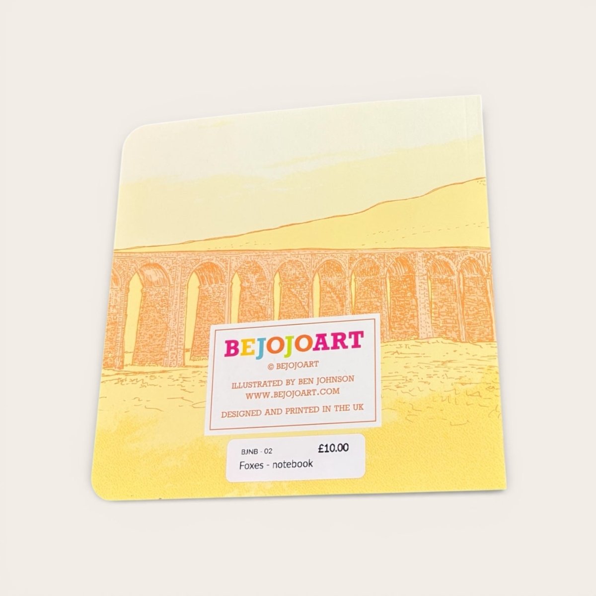 Notebook with a bridge illustration and &