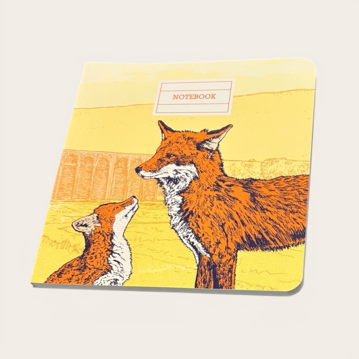 Notebook with fox illustration on a yellow background