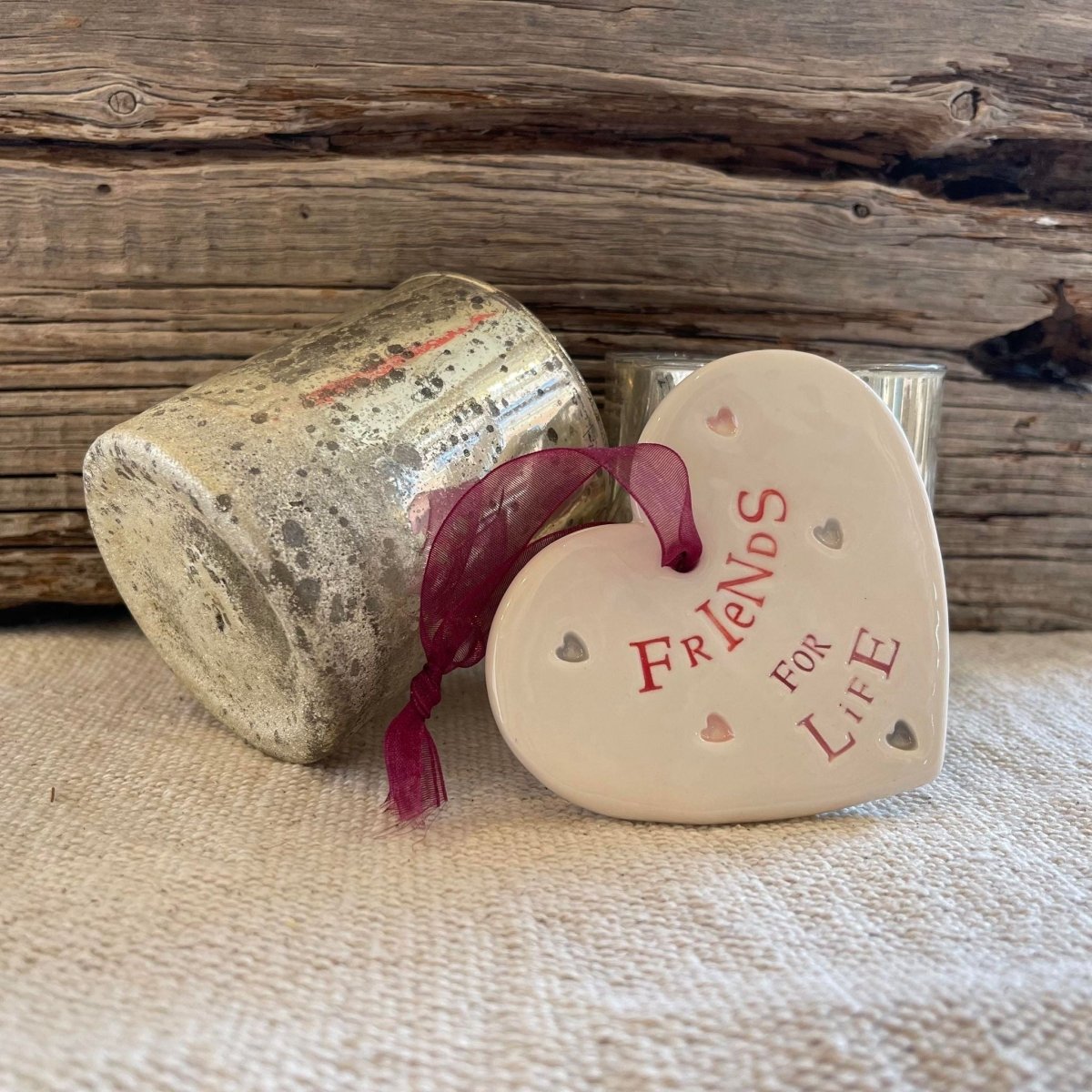 Heart-shaped ceramic piece with &