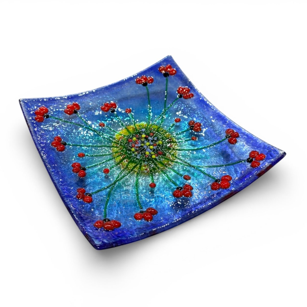 Decorative glass plate with a floral design on a white background