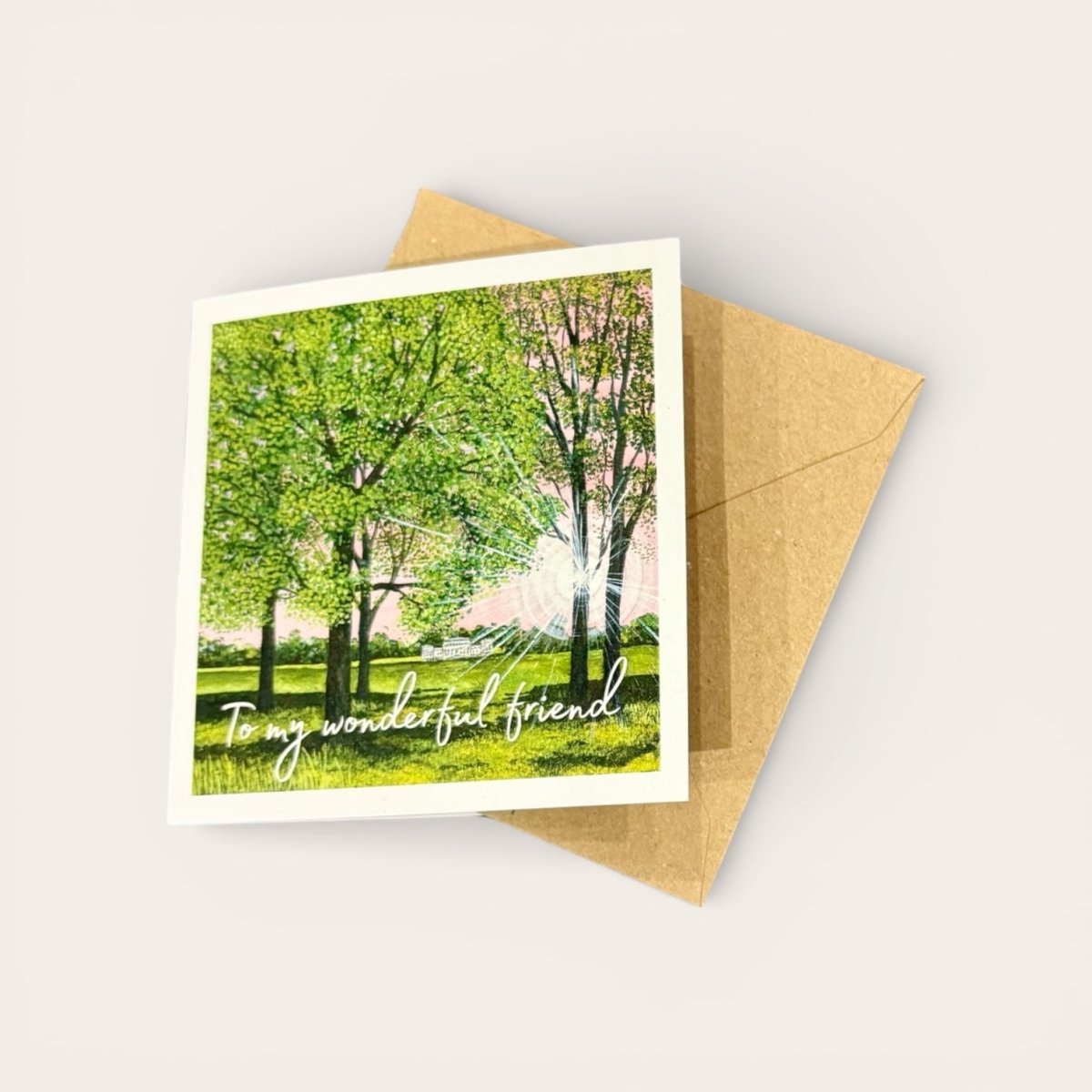 Greeting card with a scenic illustration of trees and the text &