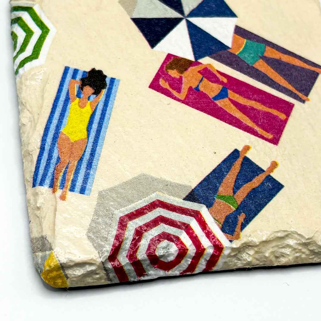 Coaster with beach-themed design featuring people on towels and umbrellas_Sarah Tustin_Just Makers