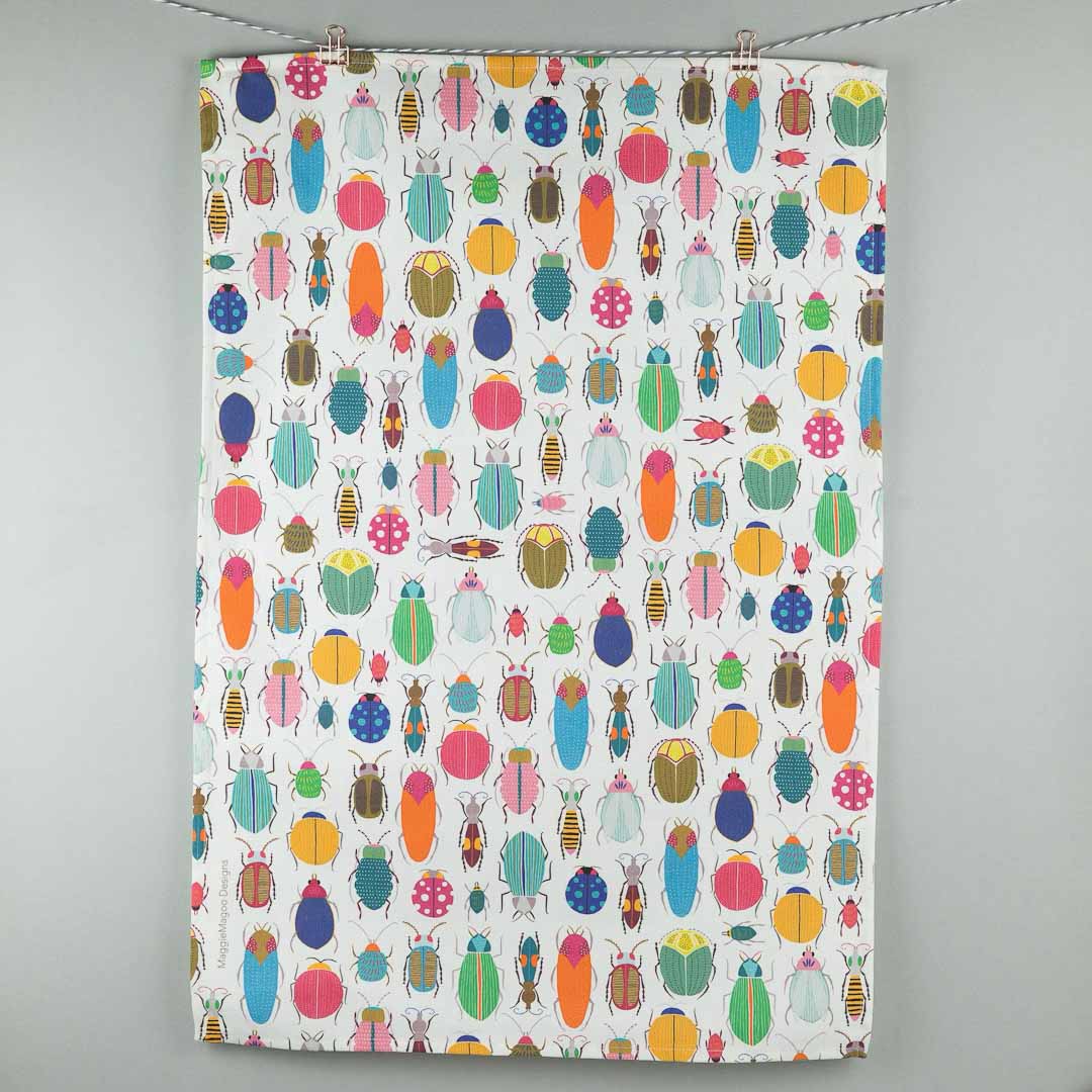 Colorful patterned fabric with beetle design on a white background_Maggie Magoo Designs_Just Makers