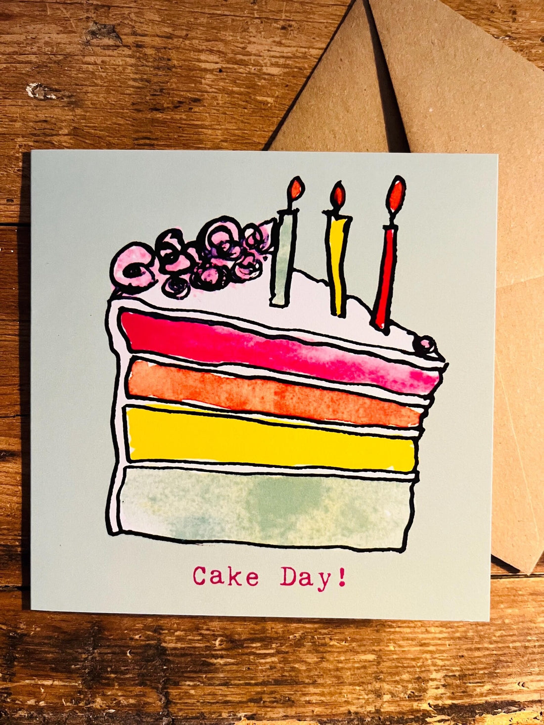 Greeting card with a colorful cake illustration and &
