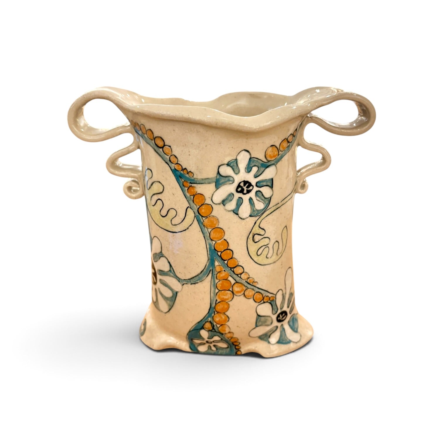 A handmade ceramic planter with a beige stoneware finish, featuring two loop handles, a flared rim, and a hand-painted floral pattern with orange beaded vines and teal flowers.