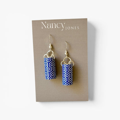 Blue and white patterned earrings on a Nancy Jones card.