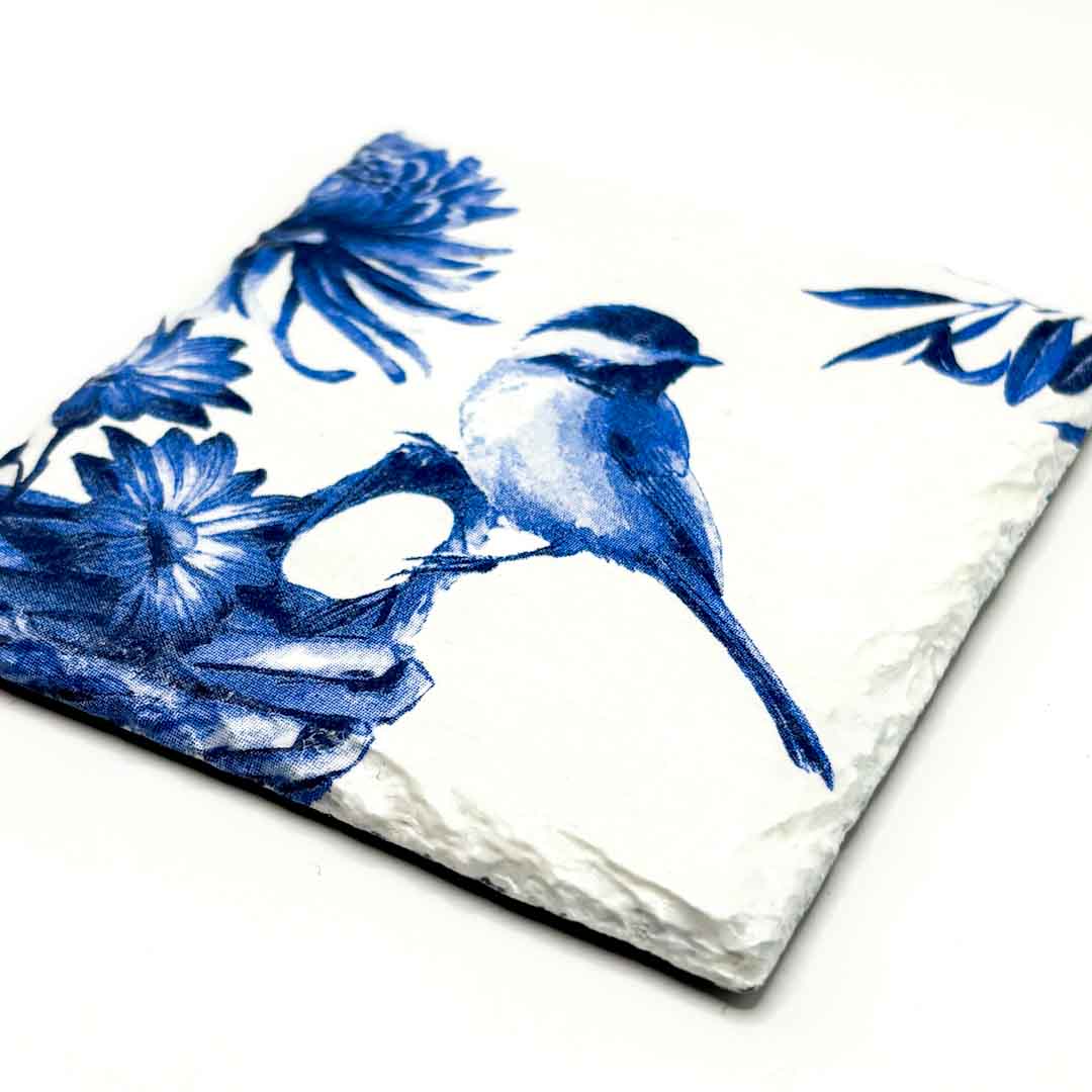 Decorative tile with blue floral and bird design on a white background_Sarah Tustin_Just Makers
