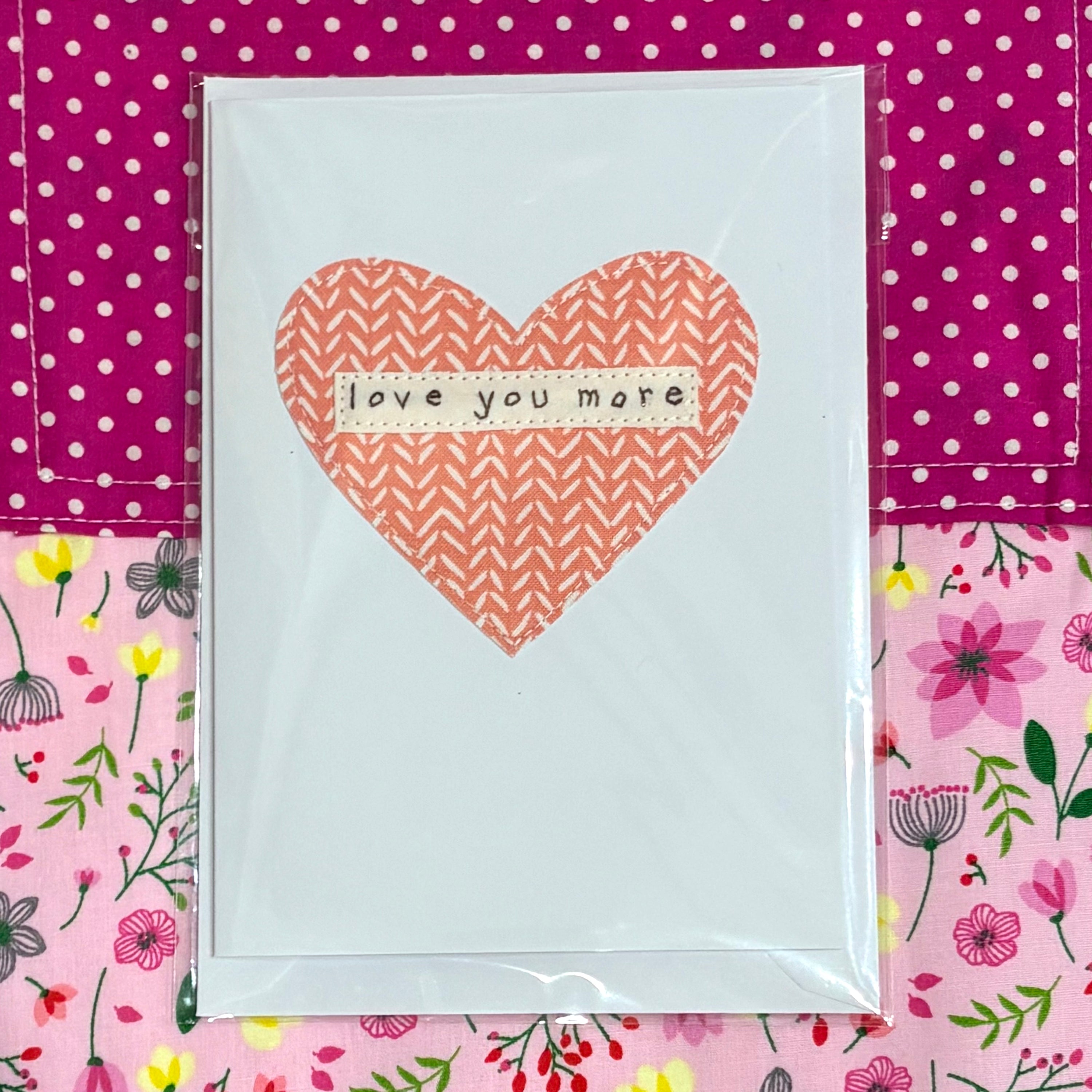 Card with a pink heart and &