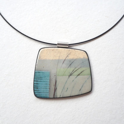 Necklace with a square pendant featuring a natural pattern on a white background