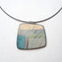 Necklace with a square pendant featuring a natural pattern on a white background