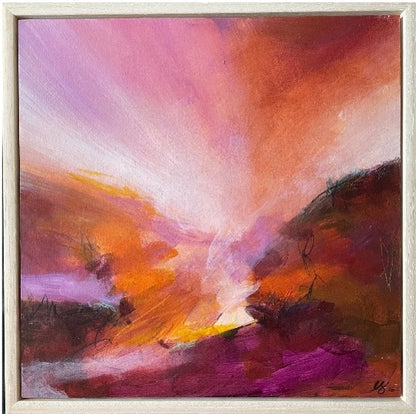 An abstract landscape painting featuring a dramatic sunset or sunrise with vibrant pink, orange, purple, and yellow brushstrokes, presented in a light-colored wooden frame.