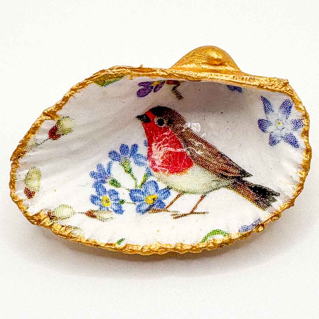 Decorative shell with a painted robin and flowers on a white background_Just Makers
