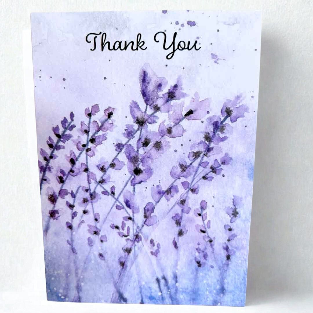 Greeting card with purple floral design and &