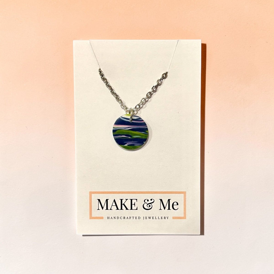 Necklace with a colorful pendant on a &