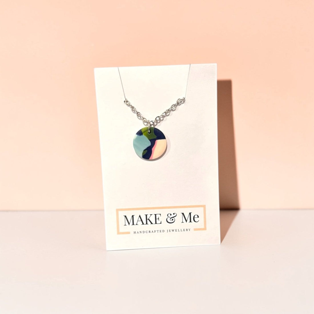 Necklace with a colorful pendant on a &