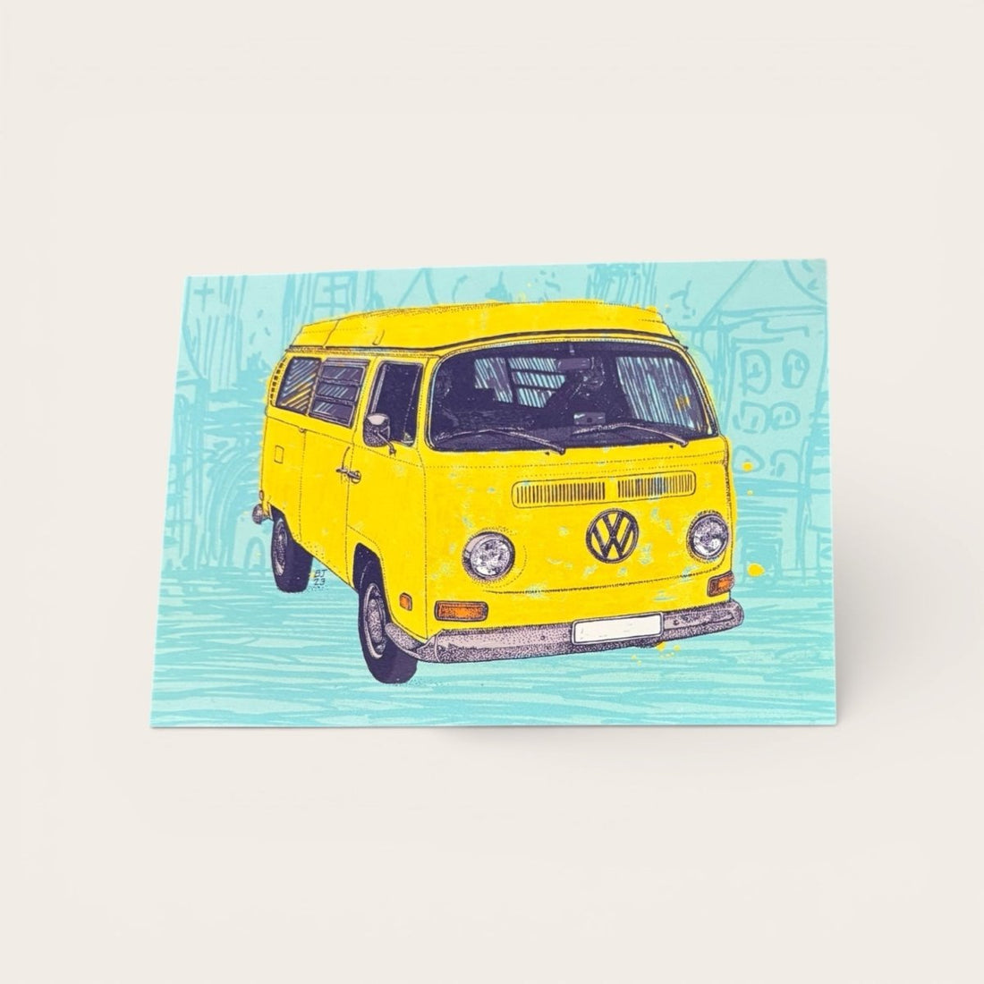 Yellow Volkswagen van on a blue patterned background