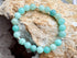 Turquoise beaded bracelet on a rock with crystals