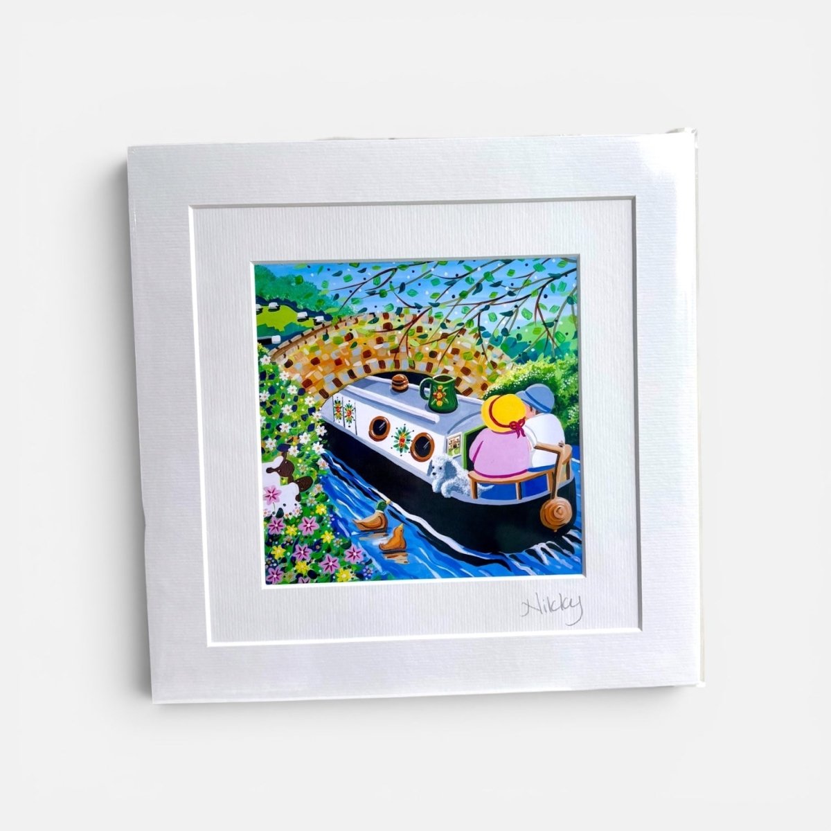 Framed artwork of a boat with a person on a white background
