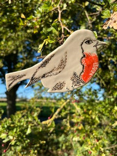 Wall hung ceramic robin with wire legs by Yorkshire ceramic artist Ciara McClarence