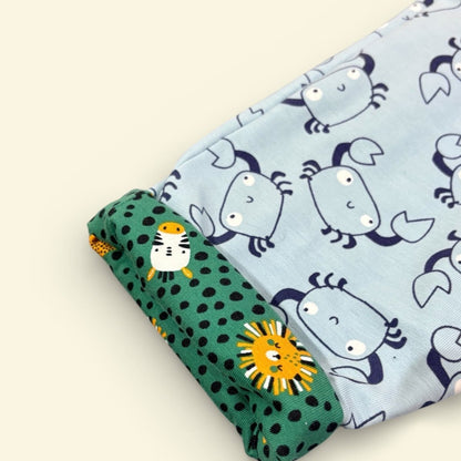 Two fabric swatches with animal patterns on a beige background