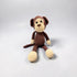 Crocheted monkey toy on a light gray background