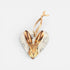 Heart-shaped hanging ornament with a hare design on a light gray background