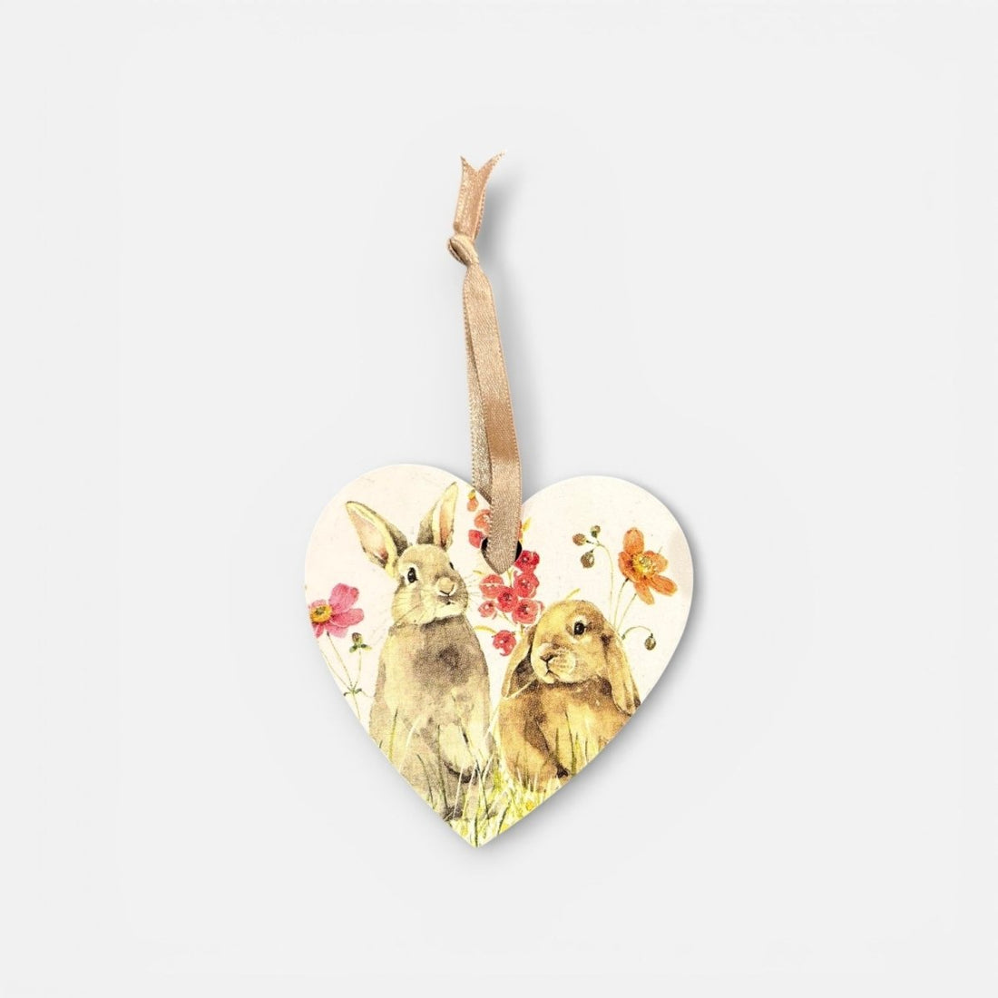 Heart-shaped wooden ornament with rabbits and flowers on a white background