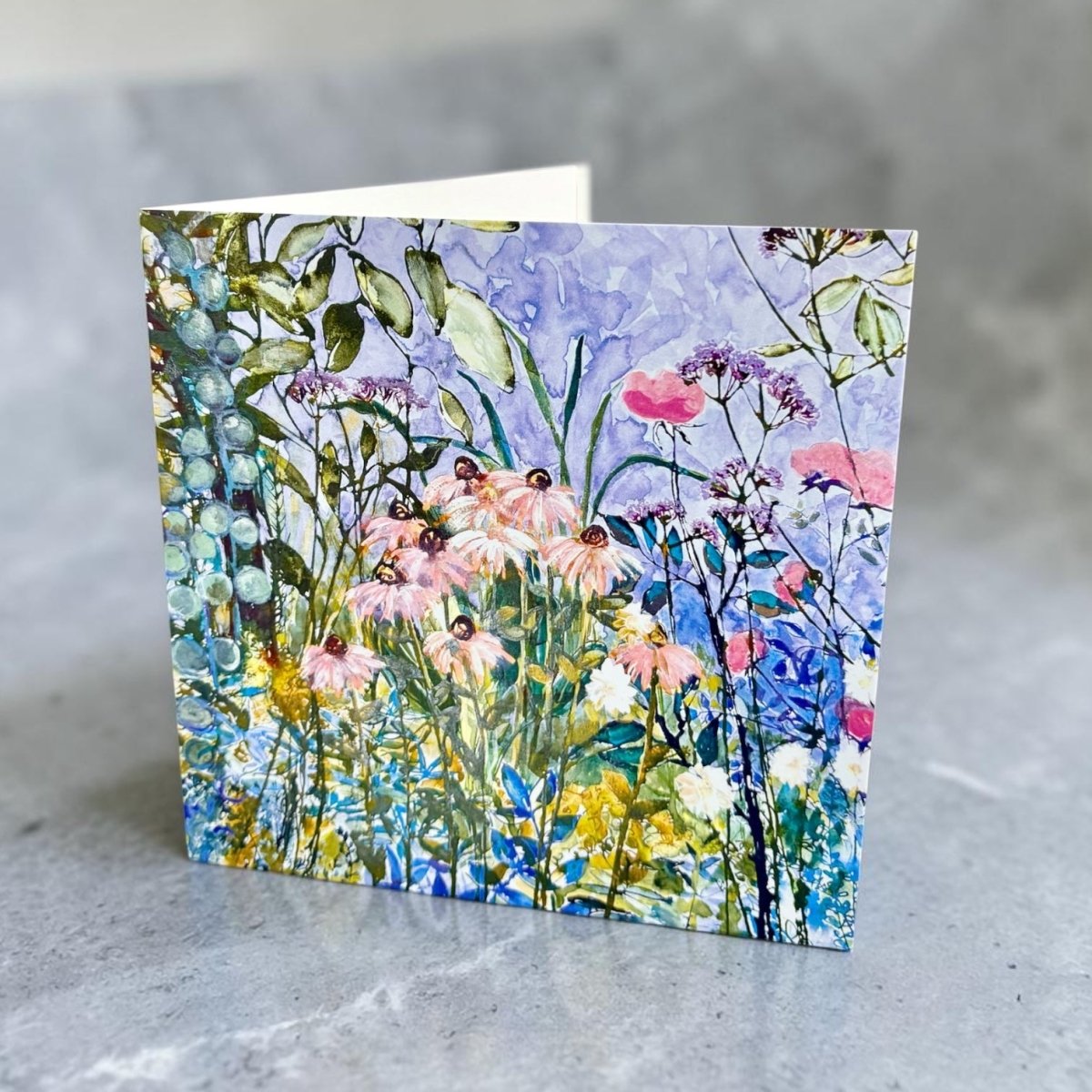 Greeting card with floral design on a textured surface