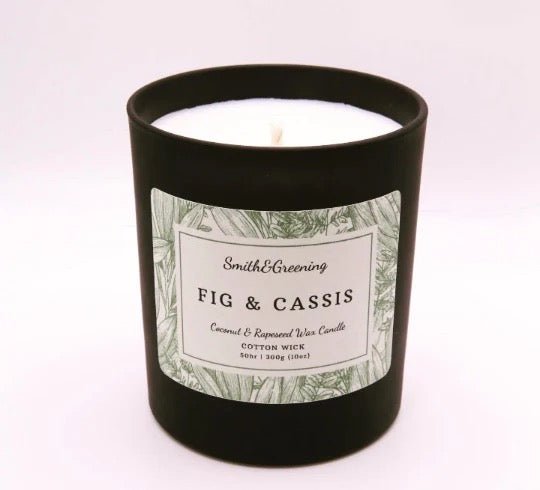 Candle with a label reading &