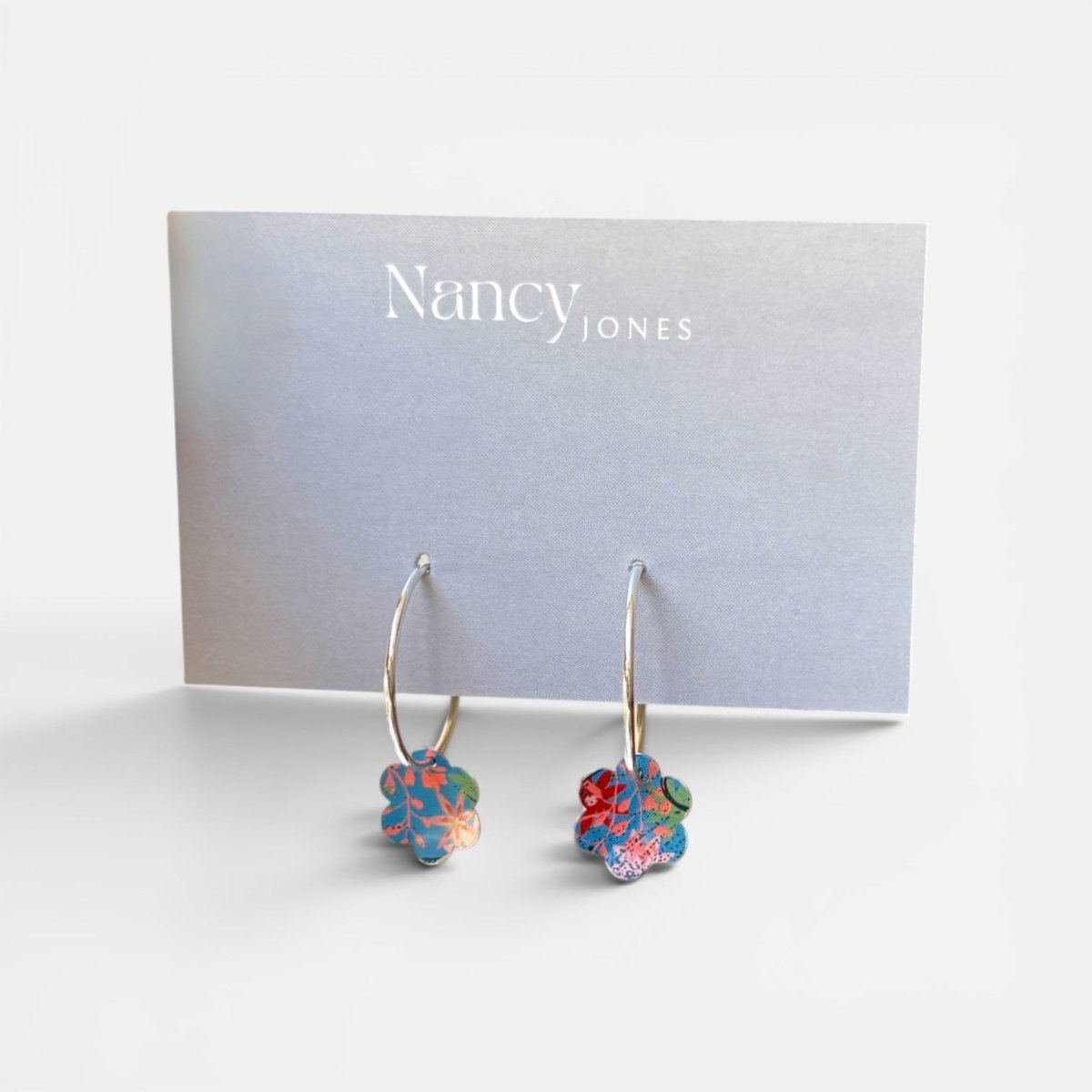 Floral hoop earrings on a Nancy Jones card