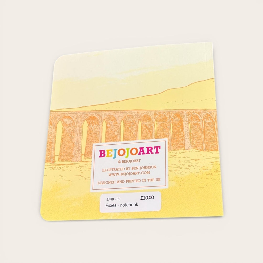 Notebook with a bridge illustration and &