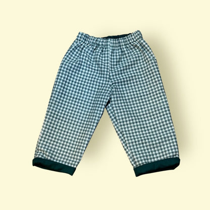 Green and white checkered pants on a beige background