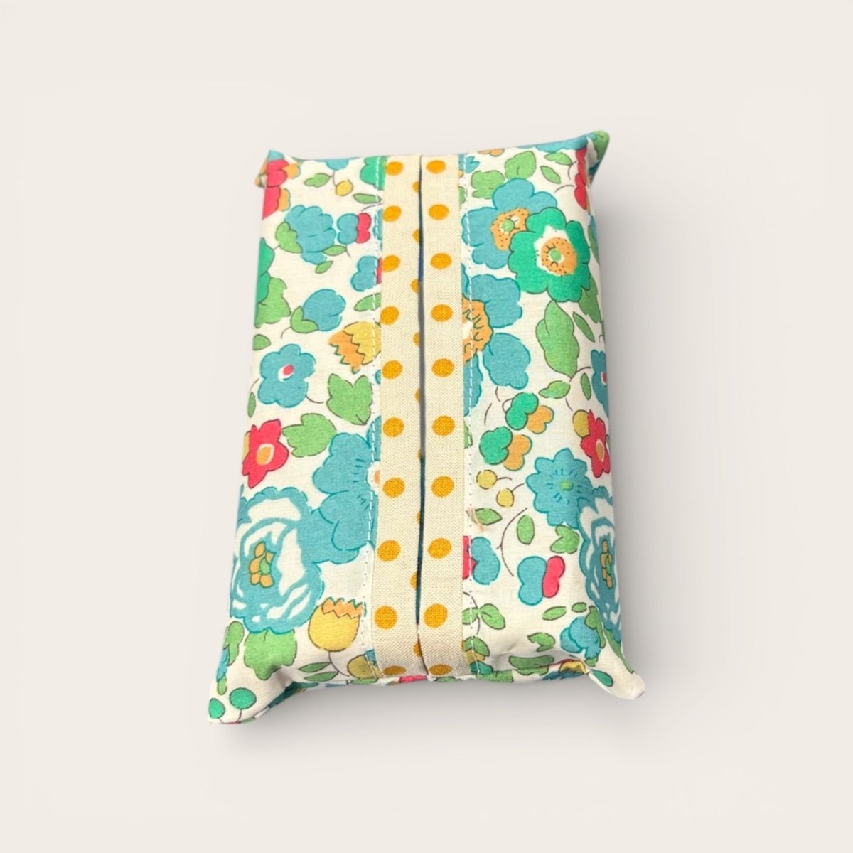 Floral-patterned tissue box cover on a white background