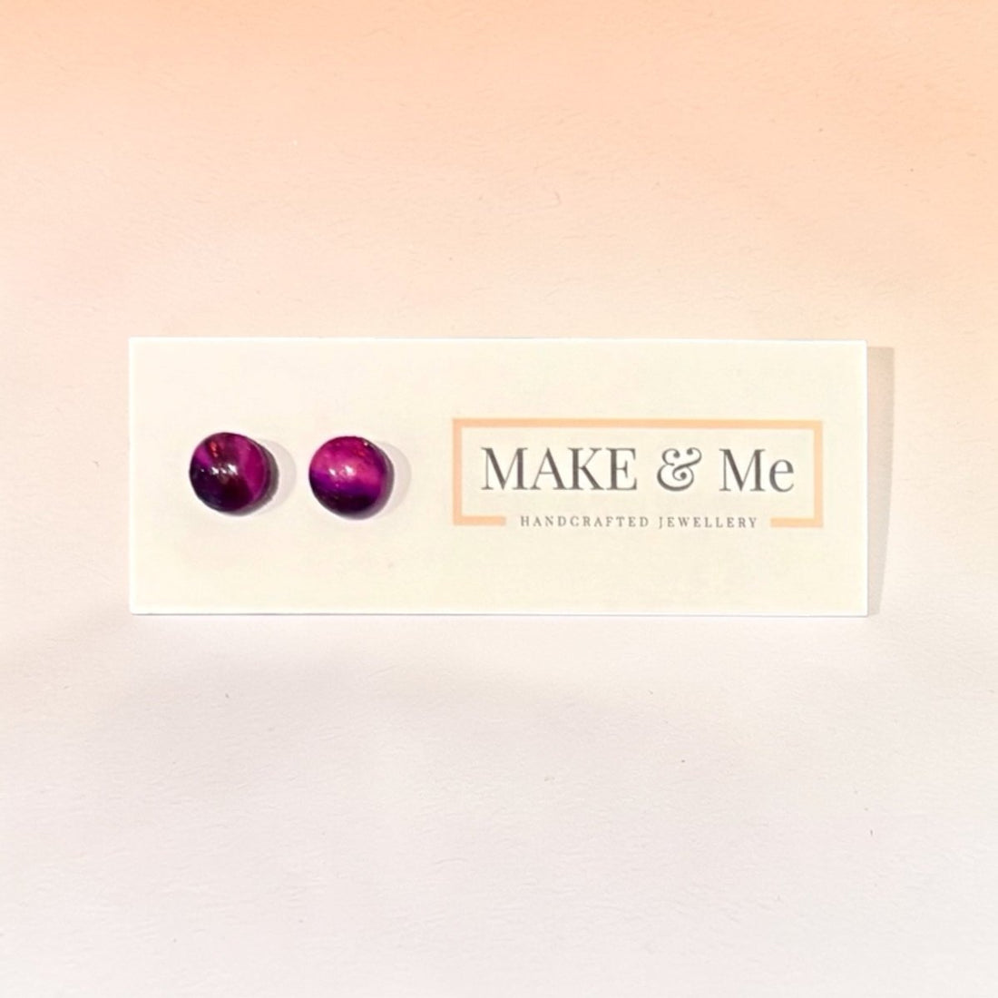 Purple earrings on a &