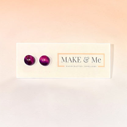 Purple earrings on a &