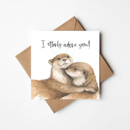 Greeting card with two otters and &