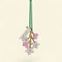 Decorative hanging ornament with flowers and a tag on a beige background