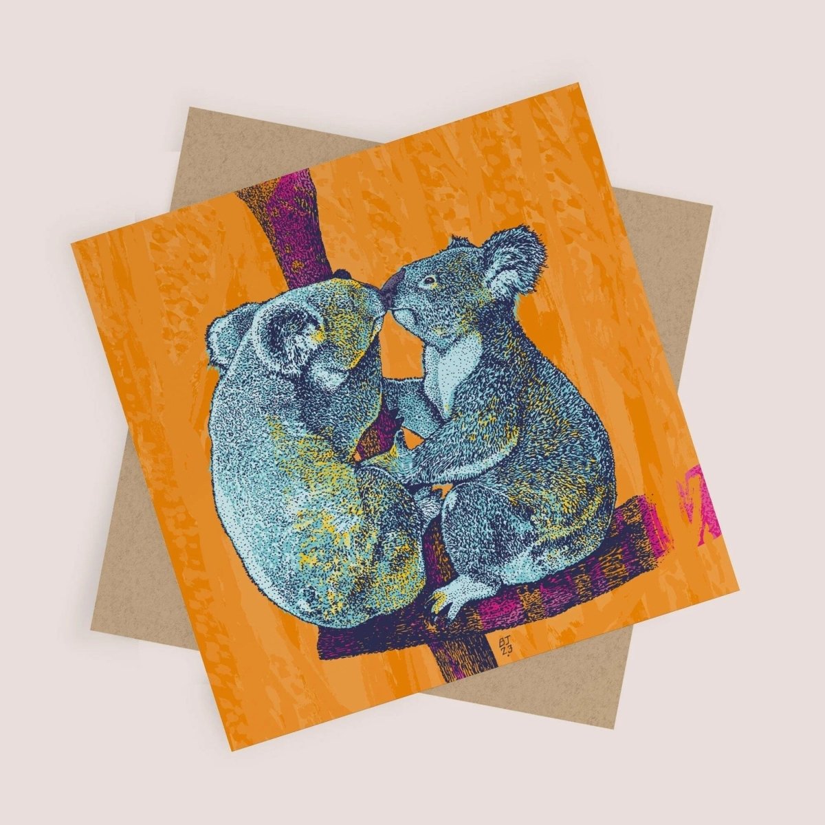 Greeting card with two koalas on an orange background